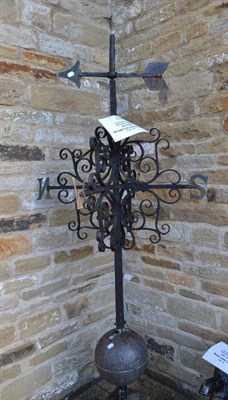 Lot 1354 - Wrought iron weather vane with C scroll bracket arm supports raised on a stone base, height 206cm