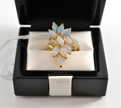 Lot 2 - A 14ct gold opal and diamond spray ring, set with marquise cabochon opals, and three round...