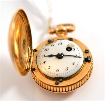Lot 4 - An early 19th century miniature fob watch in a gilt metal case, 3.2cm including suspension loop