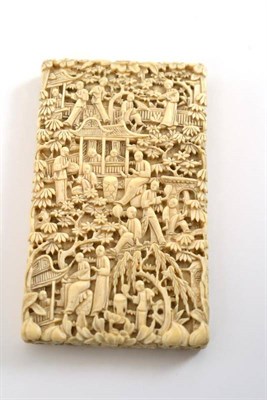 Lot 7 - A 19th century Cantonese carved ivory card case, each side carved in relief with figures...