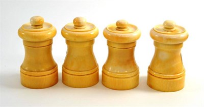 Lot 12 - A set of four early 20th century ivory pepper mills, 7.5cm high