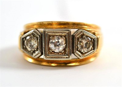 Lot 15 - A diamond three stone ring, an old cut diamond flanked by two round brilliant cut diamonds, in...