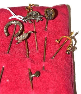 Lot 20 - Six stick pins, including a diamond and ruby set example in the form of a prowling cat, a ruby,...