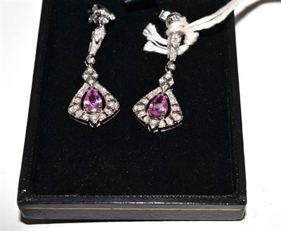 Lot 26 - A pair of pink sapphire and diamond drop earrings, round brilliant cut diamonds in white claws in a