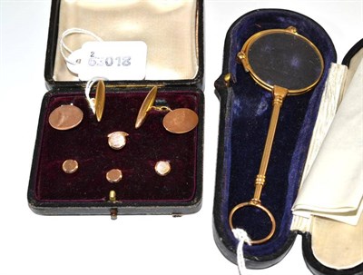 Lot 27 - A cased set of 9ct gold dress studs and cufflinks, the cufflinks with oval heads, chain linked to a