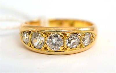 Lot 31 - A diamond five stone ring, a round brilliant cut centrally, flanked by graduated pairs of old...