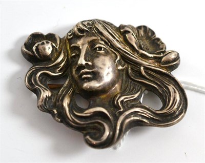 Lot 46 - An Art Nouveau style maiden's head brooch, stamped 'STERLING', measures 5.5cm by 4.9cm