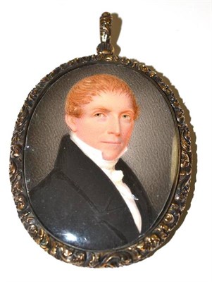 Lot 56 - English School, 19th century, miniature portrait of a gentleman wearing a black jacket, oval,...