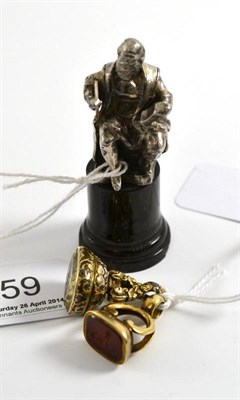 Lot 59 - Small figure of a gentleman on marble cylinder base; and two 19th century seals, one with a...