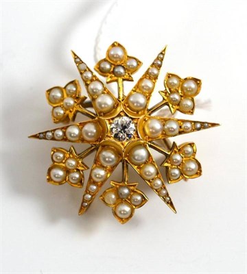 Lot 60 - A diamond and pearl star brooch/pendant, an old cut diamond centres six radial arms set with...