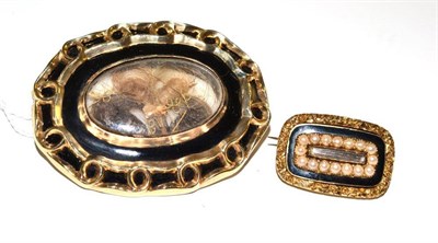 Lot 61 - A black enamelled mourning brooch with locket enclosing three locks of hair, engraved to the...