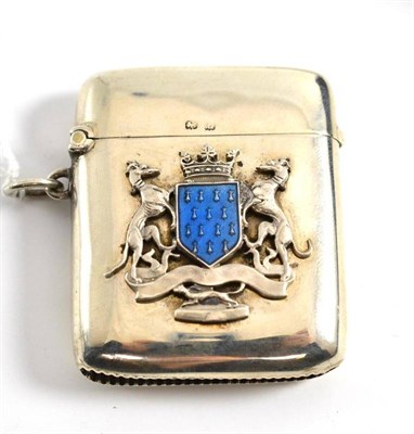 Lot 67 - A George V silver vesta case decorated with a coat of arms with blue enamel shield, Birmingham 1919
