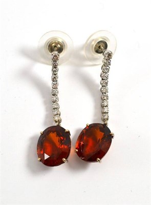 Lot 69 - A pair of 18ct white gold garnet and diamond drop earrings, a row of ten round brilliant cut...