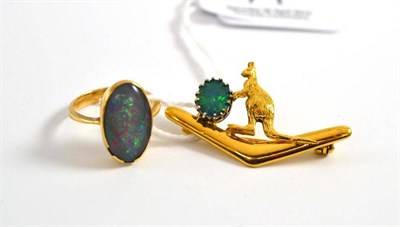 Lot 71 - An opal triplet ring, in a rubbed over setting, to a tapered shoulder plain polished shank,...