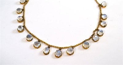 Lot 73 - A moonstone fringe necklace, the cabochon moonstones in yellow claw mounts hang from a trace...