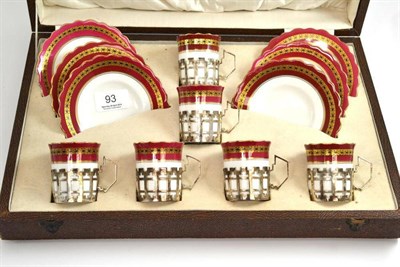 Lot 93 - A cased set of six Aynsley china coffee cans and saucers, with silver holders and claret and...