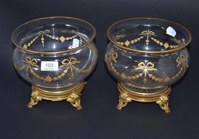 Lot 103 - A pair of 19th century French glass bowls with gilt swag decoration on gilt metal stands, 18cm high