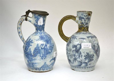 Lot 104 - A late 17th century pewter mounted Delft ewer painted in transitional style, 23.5cm high; and a...