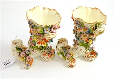 Lot 110 - A pair of mid-19th century Staffordshire porcelain encrusted cornucopia vases, 12cm high