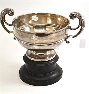 Lot 111 - An Edwardian silver twin-handled rose bowl, engraved with a crest, Chester 1906, 34cm wide,...