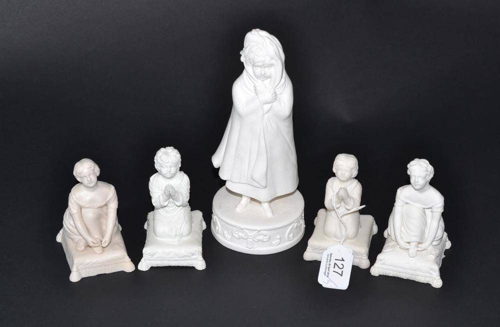 Lot 127 - A Minton bisque figure of the infant Samuel, kneeling on a cushion base, 10cm high; three other...