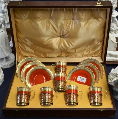 Lot 139 - An Aynsley china cased coffee service comprising six cups, saucers and silver gilt holders with...