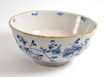 Lot 141 - An 18th century English Delft punch bowl, painted in blue with foliage, 22cm diameter