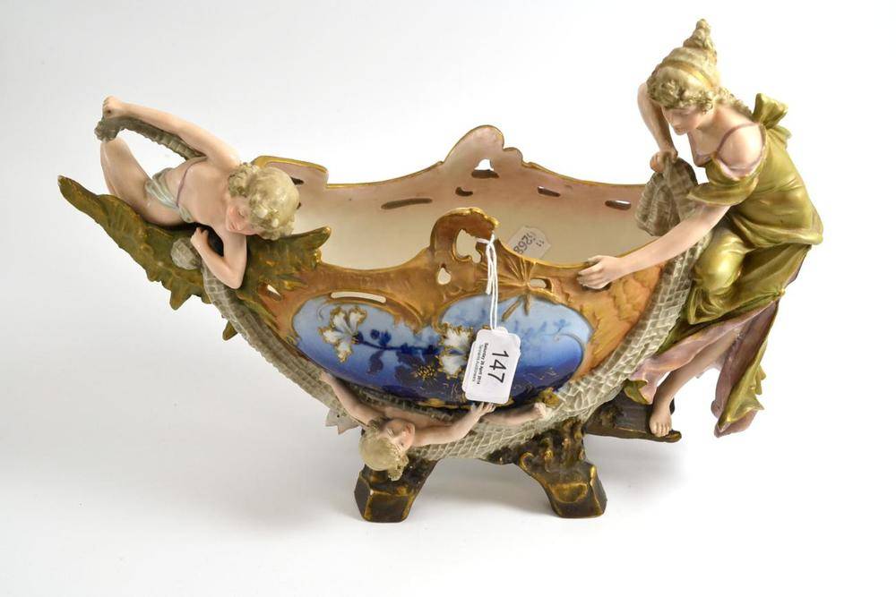 Lot 147 - Royal Bonn figural centrepiece, decorated with classical figures, 40cm wide