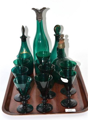 Lot 157 - A pair of Georgian green glass mallet decanters and stoppers with gilt labels for 'SHRUB' and...