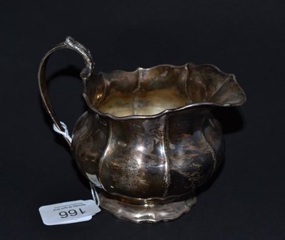 Lot 166 - # A George VI milk jug, unidentified maker's mark IP, London 1825, of lobed and compressed...