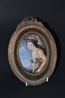 Lot 170 - A 19th century framed oval miniature depicting a lady with dog, 14cm high (excluding frame)