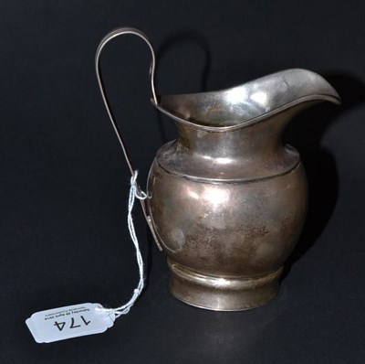 Lot 174 - A George III helmet shaped silver cream jug, Sheffield 1800, 13.5cm high