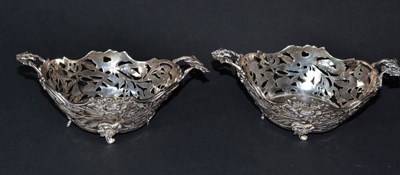 Lot 176 - A pair of silver foliate and pierced baskets with leaf decorated handles, 15cm diameter