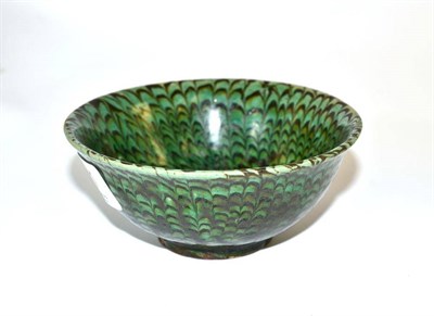 Lot 181 - A Chinese marbled green glazed bowl with combed decoration, 11.5cm diameter