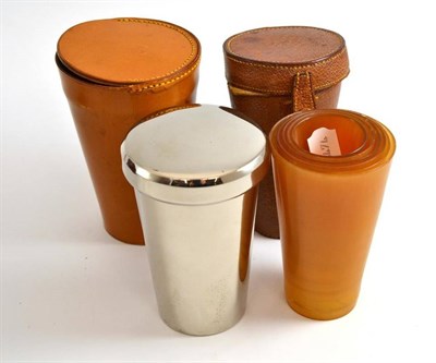 Lot 183 - A graduated set of six blonde horn beakers in pigskin case by Asprey; and a plated travelling...