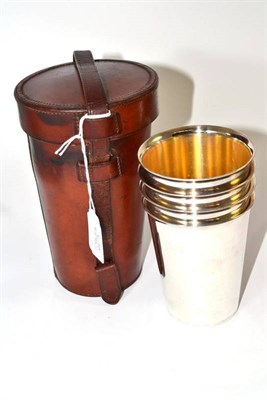 Lot 184 - Leather cased cut glass travelling spirit flask and four plated tumblers