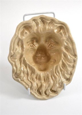 Lot 185 - A creamware jelly mould in the form of lion's mask, 15.5cm high