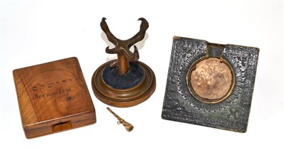 Lot 190 - A bronze claw pocket watch stand, a tooled leather pocket watch stand, wooden pocket watch...
