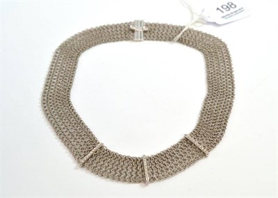 Lot 198 - An 18ct white gold mesh link collar, the entwined link with three diamond set bars at...