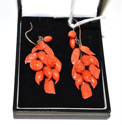 Lot 202 - A pair of coral drop earrings, depicting roses, buds and leaves, with hook fittings for pierced...