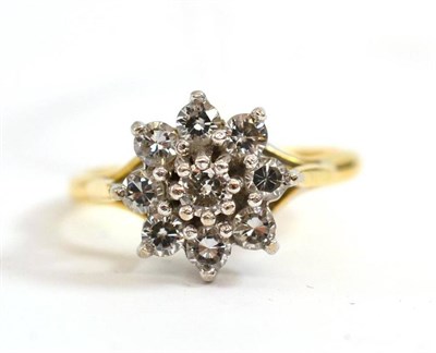 Lot 207 - An 18ct gold diamond cluster ring, the round brilliant cut diamonds in white claw settings, to...