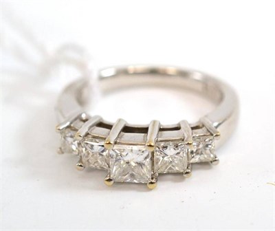 Lot 213 - A princess cut diamond five stone ring, the graduated diamonds in white claw settings, to a...