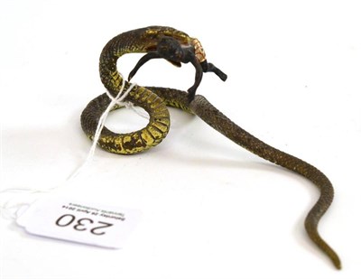 Lot 230 - A 19th century Austrian cold painted bronze group of a snake with black boy in his jaw