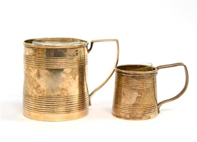 Lot 262 - A George III silver small mug, London 1818, 5.5cm high; and a similar Victorian example, London...