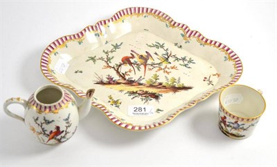 Lot 281 - ^ An 18th century Hoechst lozenge shaped tray painted with exotic birds, painted marks and a...