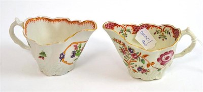 Lot 283 - Two first period Worcester porcelain ewers with chinoiserie flower decoration, both 11.5cm long