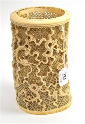 Lot 284 - Early 20th century Cantonese carved ivory tusk vase, the entire surface decorated with four...