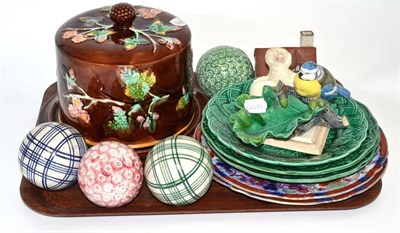 Lot 286 - Majolica stilton cheese dish, four carpet bowls, Minton majolica leaf dish surmounted by a bird...