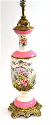 Lot 299 - A French gilt metal mounted porcelain oil lamp base, painted with flowers, 49cm high (converted...