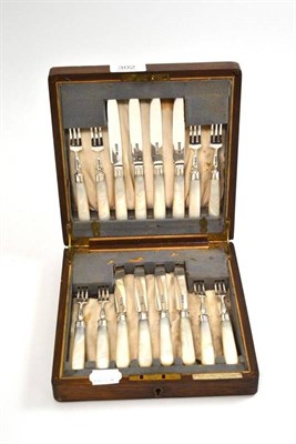 Lot 302 - Eight silver and mother-of-pearl dessert knives and forks bearing plaque Pearce & Sons Ltd